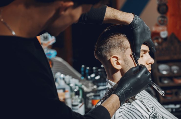 stylish-man-sitting-in-a-barbershop-EYR3SFA.jpg